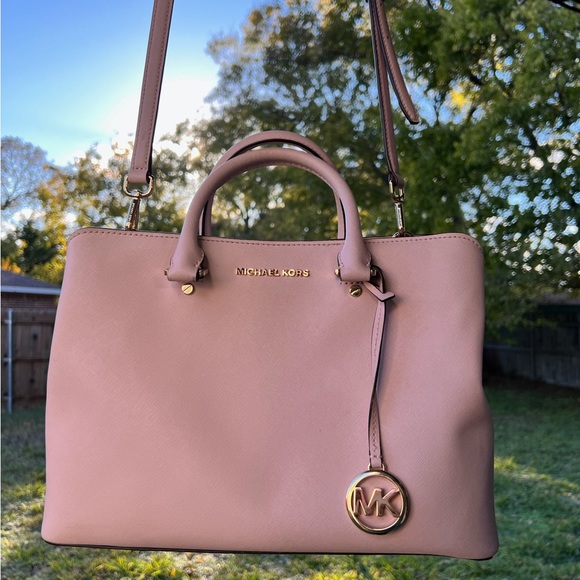 Cute Michael Kors pink bag. Holds a lot of stuff. Has three compartments. - Picture 2 of 7